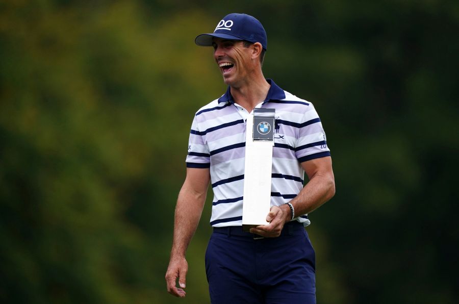 Billy Horschel of the U.S. displays the trophy following day four of the PGA Championship at Wentworth Golf Club in Virginia Water, England, Sunday Sept. 22, 2024. (Zac Goodwin/PA via AP)