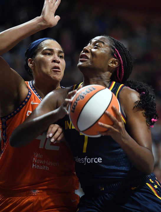 Indiana Fever's Aliyah Boston (7) attempts to move past Connecticut Sun's Brionna Jones (42) during a first-round WNBA basketball playoff game at Mohegan Sun Arena, Sunday, Sept. 22, 2024. (Sarah Gordon/The Day via AP)