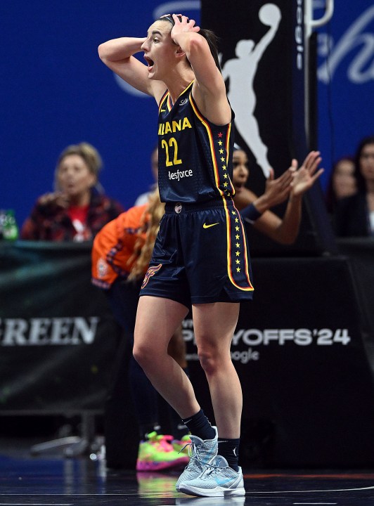 Indiana Fever's Caitlin Clark (22) reacts after a foul call during a first-round WNBA basketball playoff game against the Connecticut Sun at Mohegan Sun Arena, Sunday, Sept. 22, 2024. (Sarah Gordon/The Day via AP)