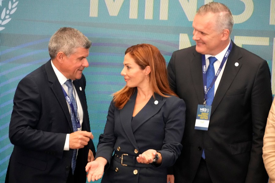 Cypriot Minister of Energy George Papanastasiou, left, talks with his counterparts of Malta Miriam Dalli, center, and Slovenia Bojan Kumer, left, during the MED9 Energy Ministerial Meeting in southern coastal city of Larnaca, Cyprus, Monday, Sept. 23, 2024. (AP Photo/Petros Karadjias)