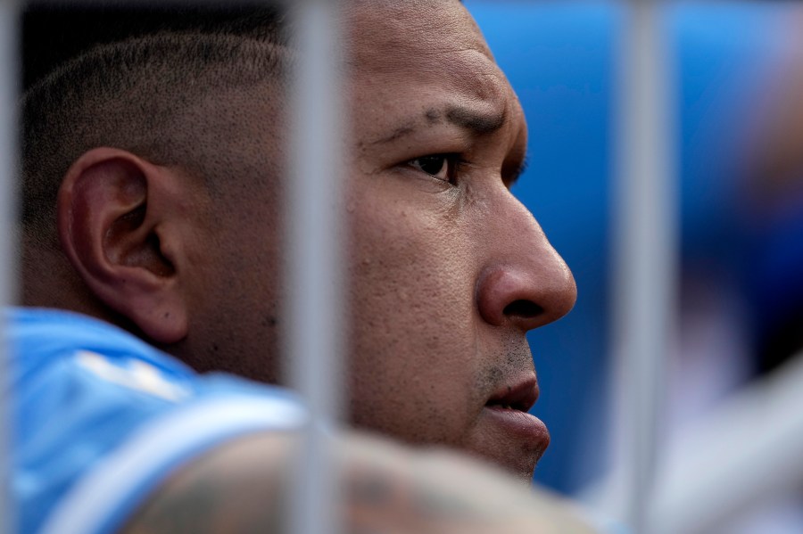 Kansas City Royals' Salvador Perez watches from the dugout during the fourth inning of a baseball game against the San Francisco Giants Saturday, Sept. 21, 2024, in Kansas City, Mo. (AP Photo/Charlie Riedel)