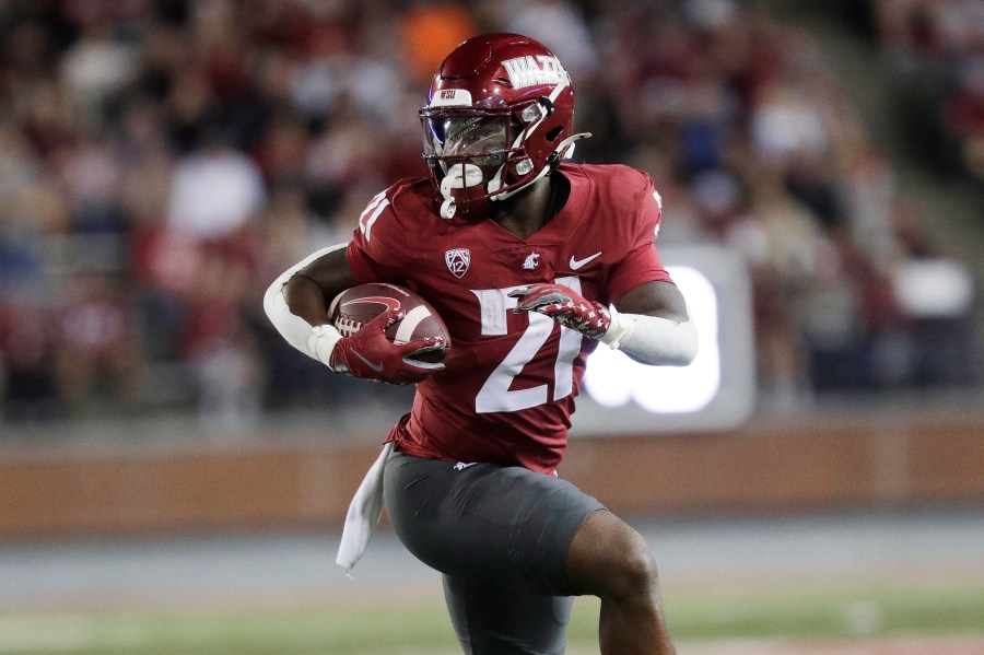 Washington State running back Wayshawn Parker carries the ball during the first half of an NCAA college football game against San Jose State, Friday, Sept. 20, 2024, in Pullman, Wash. (AP Photo/Young Kwak)