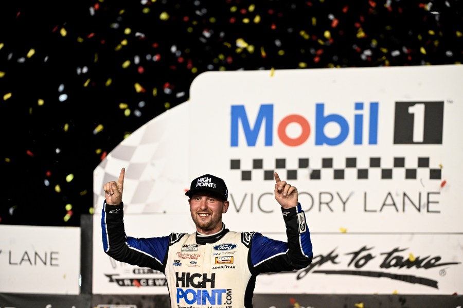 Chase Briscoe celebrates in Victory Lane after winning a NASCAR Cup Series auto race at Darlington Raceway, Sunday, Sept. 1, 2024, in Darlington, S.C. (AP Photo/Matt Kelley)