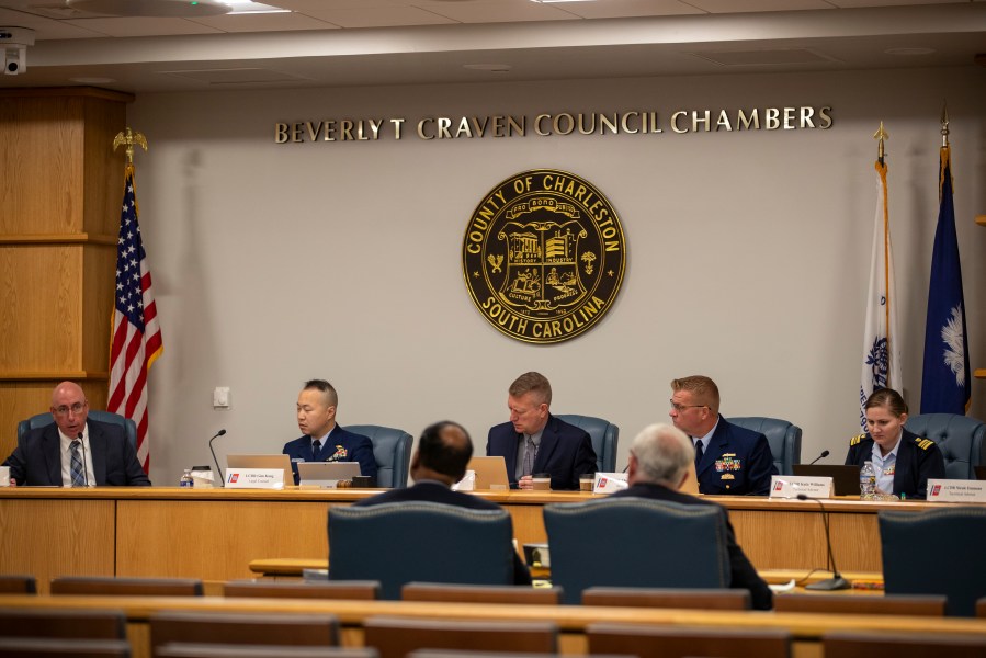 Members of the Coast Guard's Titan Submersible Marine Board of Investigation listen during the formal hearing inside the Charleston County Council Chambers, Monday, Sept. 23, 2024, in North Charleston, S.C. (Laura Bilson/The Post And Courier via AP, Pool)