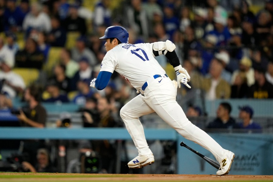 Los Angeles Dodgers' Shohei Ohtani heads to first for a double during the first inning of a baseball game against the San Diego Padres, Tuesday, Sept. 24, 2024, in Los Angeles. (AP Photo/Mark J. Terrill)