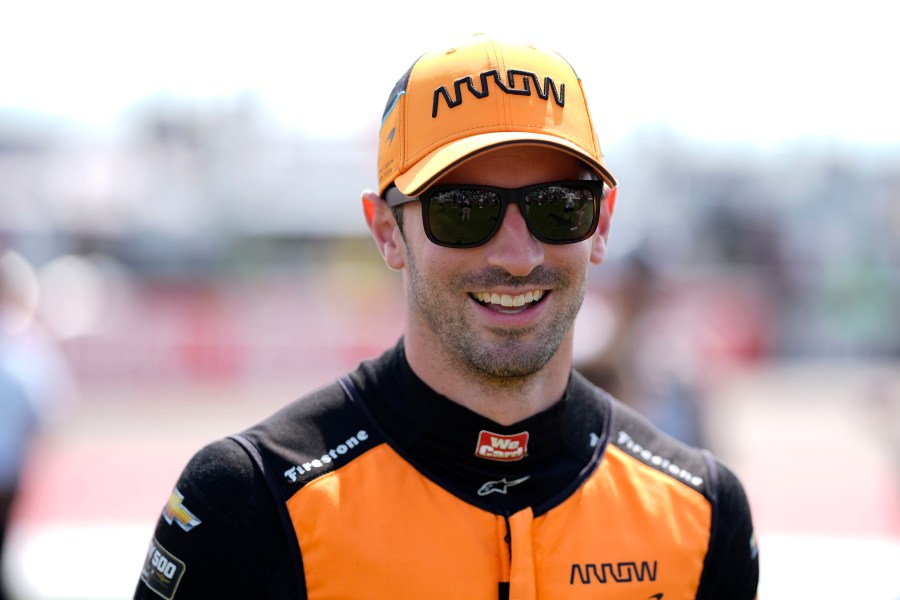 FILE - Alexander Rossi walks to driver introductions before an IndyCar auto race, Sunday, July 14, 2024, at Iowa Speedway in Newton, Iowa. (AP Photo/Charlie Neibergall, File)