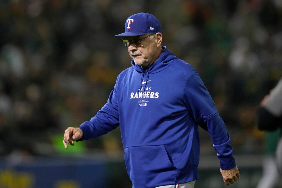 Texas Rangers manager Bruce Bochy walks to the dugout after making a pitching change during the fourth inning of a baseball game against the Oakland Athletics in Oakland, Calif., Wednesday, Sept. 25, 2024. (AP Photo/Jeff Chiu)