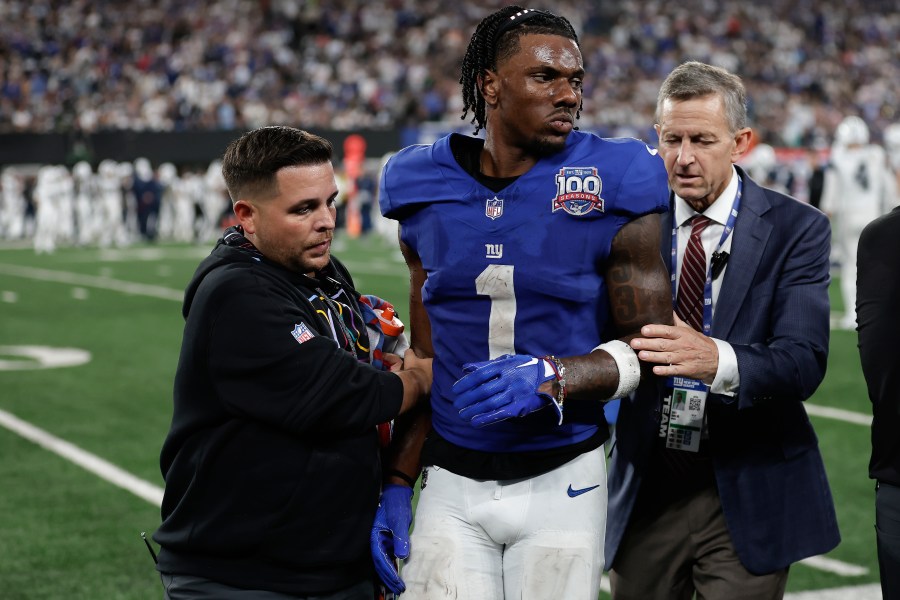 New York Giants wide receiver Malik Nabers (1) is helped off the field after an injury during the fourth quarter of an NFL football game against the Dallas Cowboys, Thursday, Sept. 26, 2024, in East Rutherford, N.J. (AP Photo/Adam Hunger)