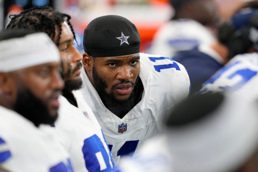 Dallas Cowboys linebacker Micah Parsons (11) sits on the bench alongside teammates in the second half of an NFL football game against the Baltimore Ravens in Arlington, Texas, Sunday, Sept. 22, 2024. (AP Photo/Jeffrey McWhorter)