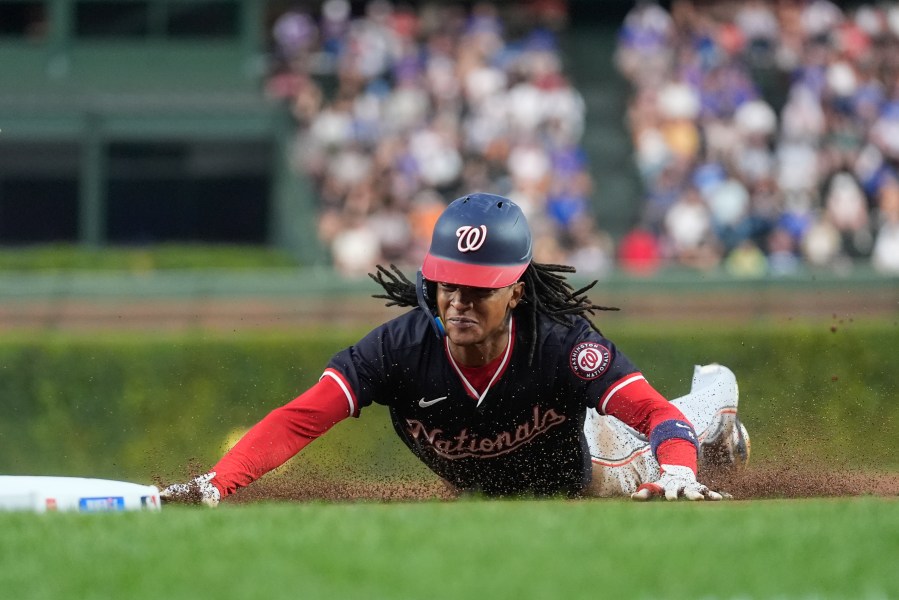 Washington Nationals' CJ Abrams steals third base during the first inning of a baseball game against the Chicago Cubs, Thursday, Sept. 19, 2024, in Chicago. (AP Photo/Erin Hooley)