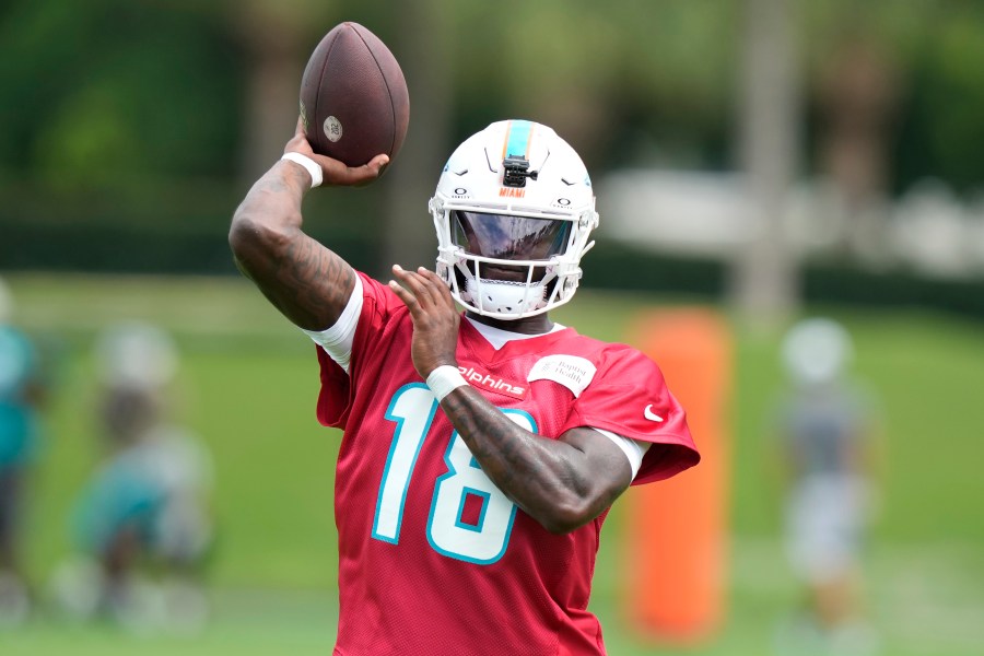 Miami Dolphins quarterback Tyler Huntley (18) throws a pass during practice at the NFL football team's training facility, Wednesday, Sept. 18, 2024, in Miami Gardens, Fla. (AP Photo/Lynne Sladky)