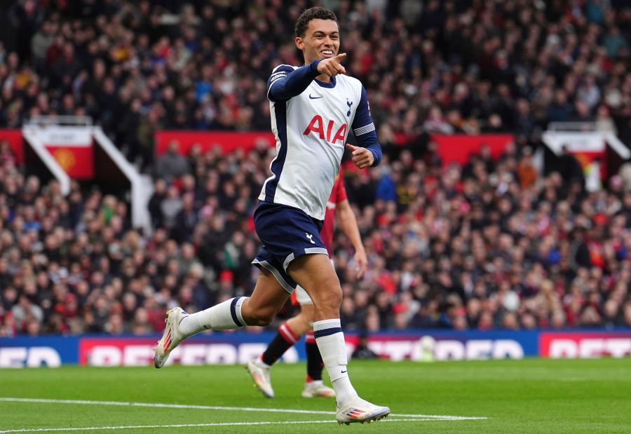 Tottenham's Brennan Johnson celebrates after scoring his side's opening goal during the English Premier League soccer match between Manchester United and Tottenham Hotspur at Old Trafford stadium in Manchester, England, Sunday, Sept. 29, 2024: (Martin Rickett/PA via AP)