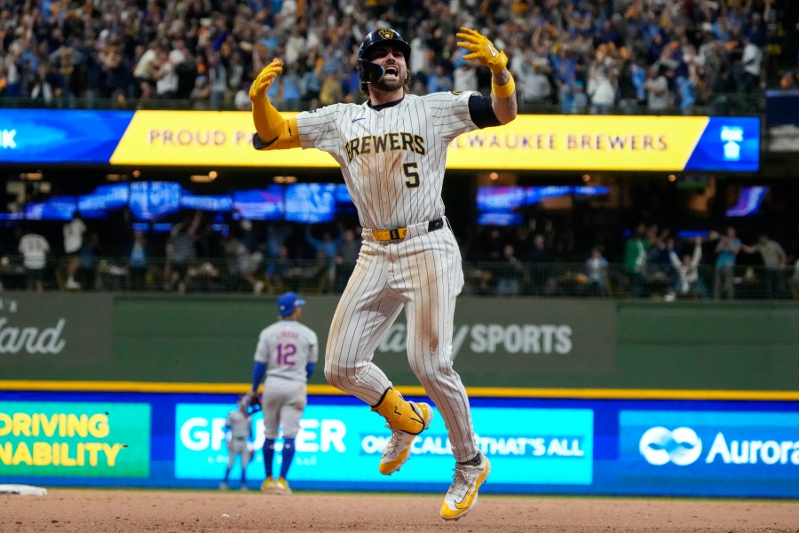 Milwaukee Brewers' Garrett Mitchell celebrates afrer hitting a two-run home run during the eighth inning of Game 2 of a National League wild card baseball game against the New York Mets Wednesday, Oct. 2, 2024, in Milwaukee. (AP Photo/Morry Gash)