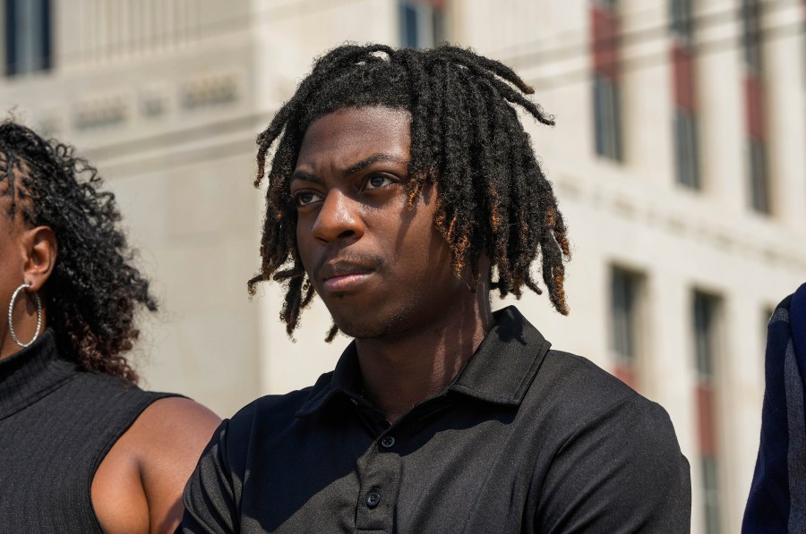 FILE - Darryl George stands next to his mother, Darresha George, in front of Galveston County Court House, May 23, 2024, in Galveston, Texas. A federal judge on Friday, Oct. 4, 2024 denied a request by Darryl George, a Black high school student in Texas for a court order that the student’s lawyers say would have allowed him to return to his high school without fear of having his previous punishment over his hairstyle resume.(Raquel Natalicchio/Houston Chronicle via AP, File)