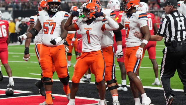 Syracuse running back LeQuint Allen (1) celebrates with teammates after scoring a touchdown against UNLV in the first half during an NCAA college football game, Friday, Oct. 4, 2024, in Las Vegas. (AP Photo/Rick Scuteri)