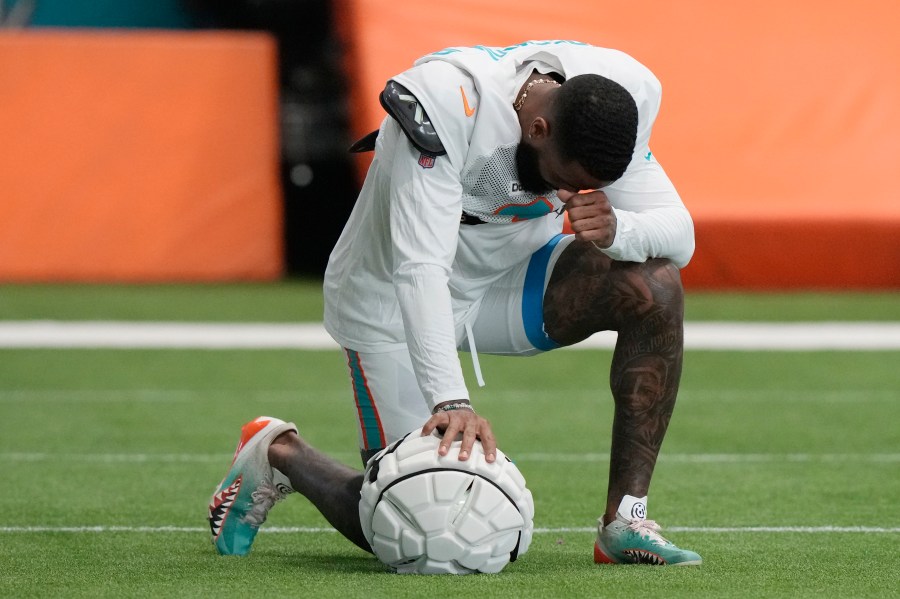 Miami Dolphins wide receiver Odell Beckham Jr. takes a moment during practice at the NFL football team's training facility, Thursday, Oct. 3, 2024, in Miami Gardens, Fla. (AP Photo/Lynne Sladky)