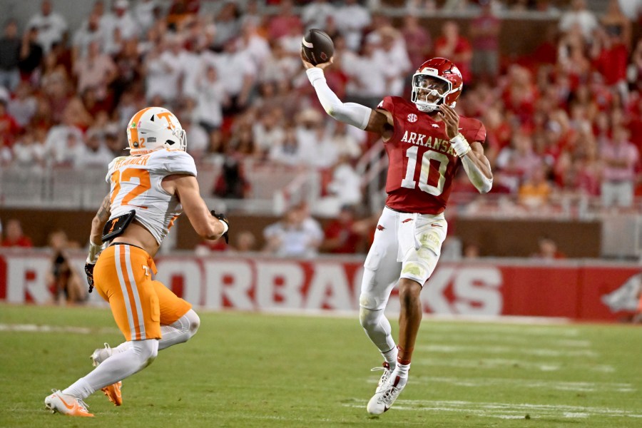 Arkansas quarterback Taylen Green (10) throws a pass over Tennessee linebacker Jeremiah Telander (22) during the first half of an NCAA college football game, Saturday, Oct. 5, 2024, in Fayetteville, Ark. (AP Photo/Michael Woods)