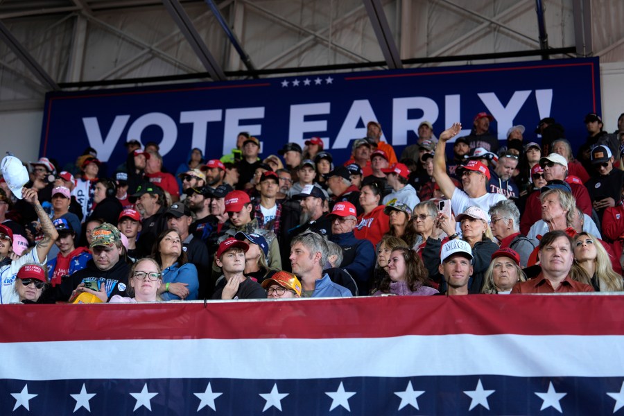 Attendees wait for Republican presidential nominee former President Donald Trump to speak during a campaign rally at Dodge County Airport, Sunday, Oct. 6, 2024, in Juneau, Wis. (AP Photo/Julia Demaree Nikhinson)