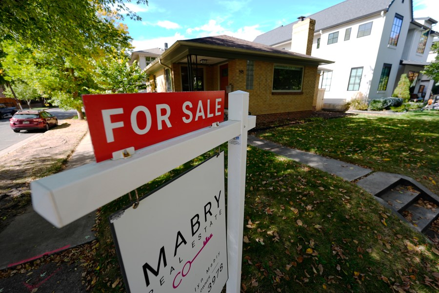 FILE - A sale sign stands outside a home on the market Thursday, Oct. 17, 2024, in the east Washington Park neighborhood of Denver. (AP Photo/David Zalubowski, File)