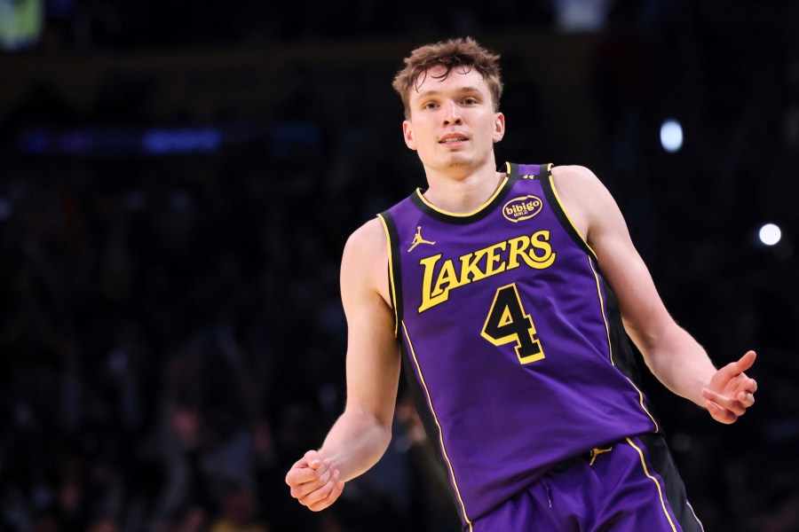 Los Angeles Lakers guard Dalton Knecht celebrates after scoring a 3-pointer during the second half of an Emirates NBA Cup basketball game against the Utah Jazz, Tuesday, Nov. 19, 2024, in Los Angeles. (AP Photo/Etienne Laurent)