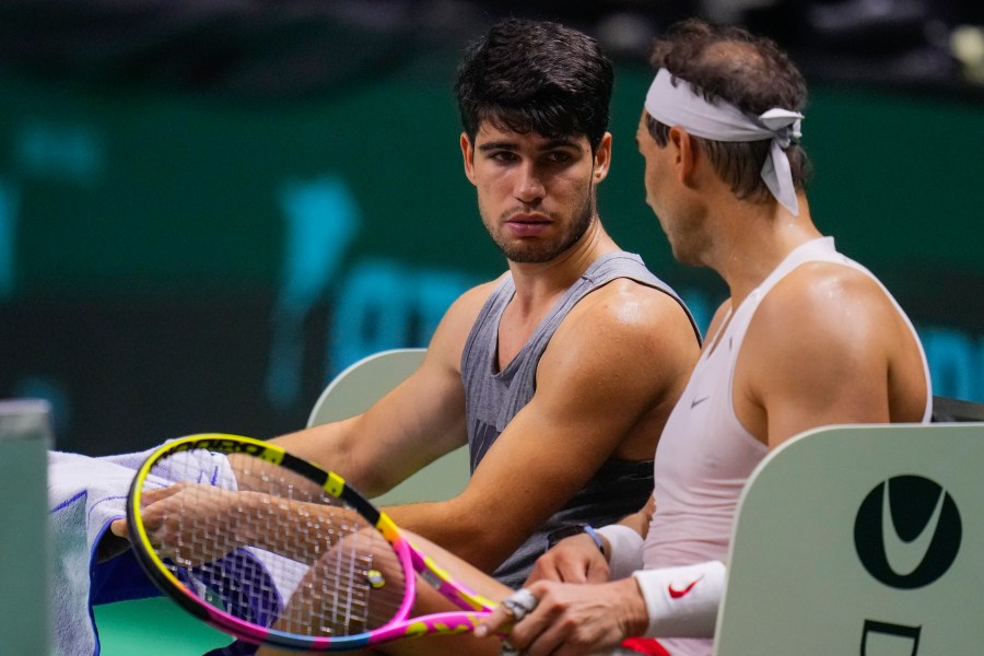 Spain's tennis players Carlos Alcaraz, left, and Rafael Nadal attend a training session in Malaga, southern Spain, on Monday, Nov. 18, 2024. (AP Photo/Manu Fernandez)