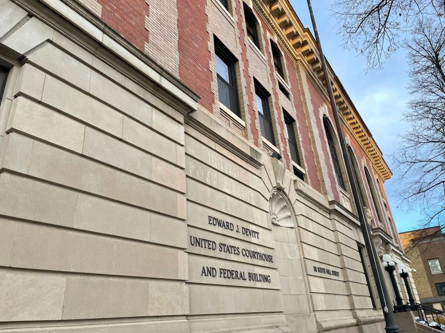 The Edward J. Devitt U.S. Courthouse and Federal building is seen, where two men on trial face human smuggling charges, Monday, Nov. 18, 2024, in Fergus Falls, Minn. (AP Photo/Michael Goldberg)