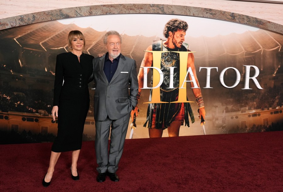 Ridley Scott, right, director of "Gladiator II," poses with his wife Giannina Facio at the premiere of the film on Monday, Nov. 18, 2024, at TCL Chinese Theatre in Los Angeles. (AP Photo/Chris Pizzello)