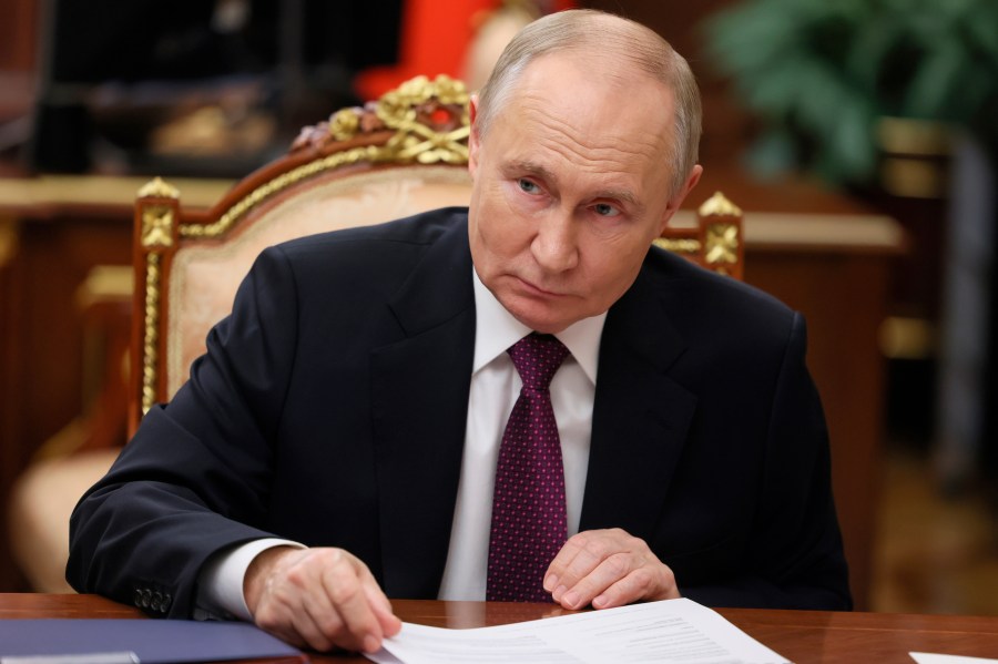 Russian President Vladimir Putin meets with First Deputy Prime Minister Denis Manturov at the Kremlin, in Moscow, Russia, Wednesday, Nov. 20, 2024. (Vyacheslav Prokofyev, Sputnik, Kremlin Pool Photo via AP)