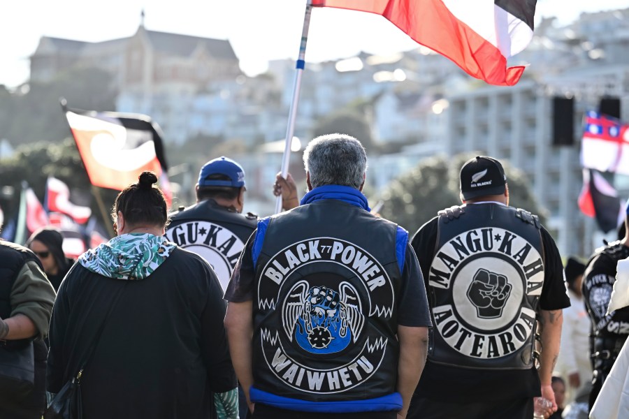 Members of patched gangs gather before marching to parliament during a protest against a proposed law that would redefine the country's founding agreement between Indigenous Māori and the British Crown, in Wellington, New Zealand, Tuesday, Nov. 19, 2024. (AP Photo/Mark Tantrum)