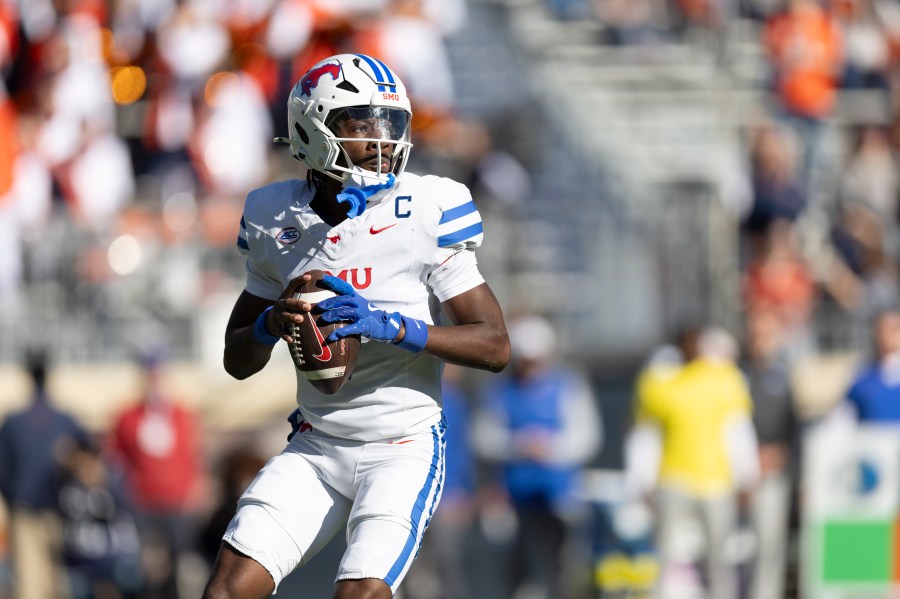 SMU quarterback Kevin Jennings (7) looks to pass during the first half of an NCAA college football game against Virginia, Saturday, Nov. 23, 2024, in Charlottesville, Va. (AP Photo/Mike Kropf)