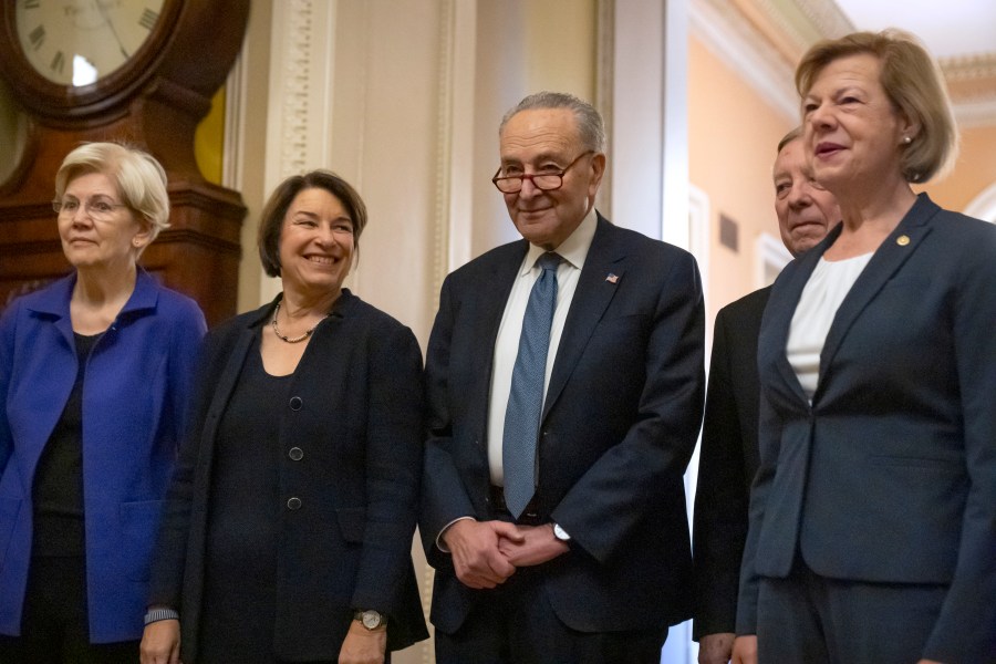 Senators, from left, Sen. Elizabeth Warren, D-Mass., Sen. Amy Klobuchar, D-Minn., Senate Majority Leader Chuck Schumer of N.Y., Sen. Dick Durbin, D-Ill., and Sen. Tammy Baldwin, D-Wis., gather after Senate Democratic leadership elections for the next session of Congress on Capitol Hill, Tuesday, Dec. 3, 2024, in Washington. (AP Photo/Mark Schiefelbein)