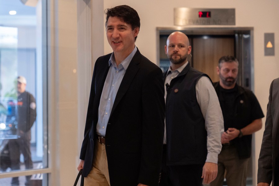 Canada Prime Minister Justin Trudeau walks through the lobby of the Delta Hotel by Marriott, Saturday, Nov. 30, 2024, in West Palm Beach, Fla. (AP Photo/Carolyn Kaster)