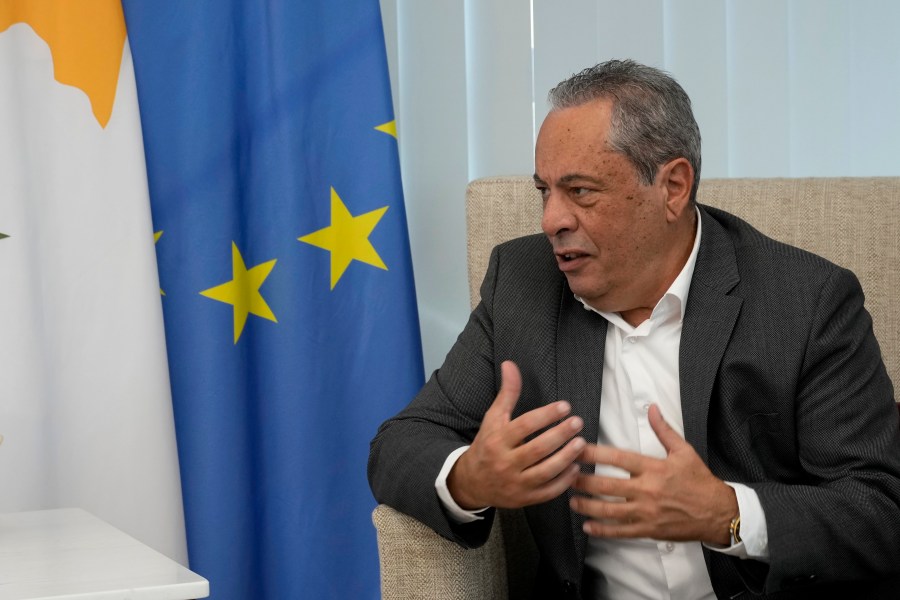 Minister of Defence Vasilis Palmas talks during an interview with the Associated Press at his office in the Defence ministry in divided capital Nicosia, Cyprus, Tuesday, Dec. 10, 2024. (AP Photo/Petros Karadjias)