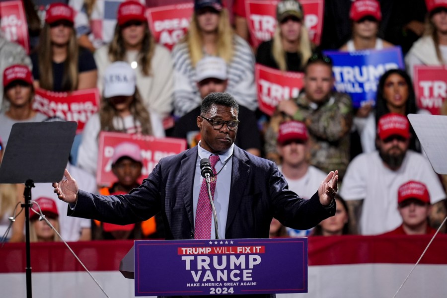 FILE - Herschel Walker speaks during a campaign rally at Atrium Health Amphitheater for Republican presidential nominee former President Donald Trump, Nov. 3, 2024, in Macon, Ga. (AP Photo/Mike Stewart)