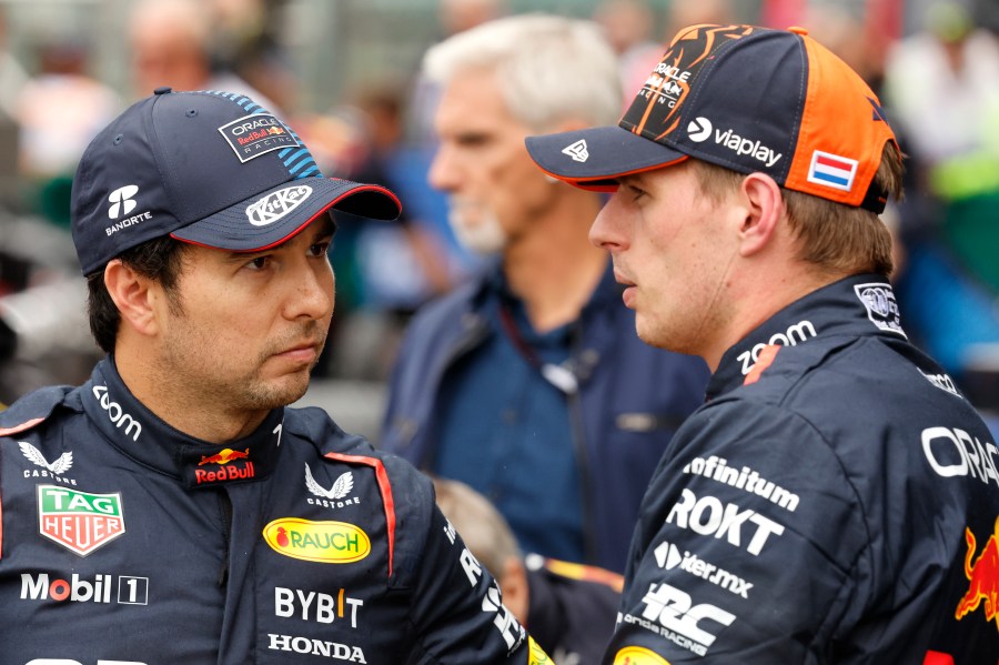 FILE- Red Bull driver Max Verstappen of the Netherlands, right, who clocked the fastest time, speaks with Red Bull driver Sergio Perez of Mexico , who clocked the third fastest time during qualification ahead of the Formula One Grand Prix at the Spa-Francorchamps racetrack in Spa, Belgium, Saturday, July 27, 2024. (AP Photo/Geert Vanden Wijngaert, File0