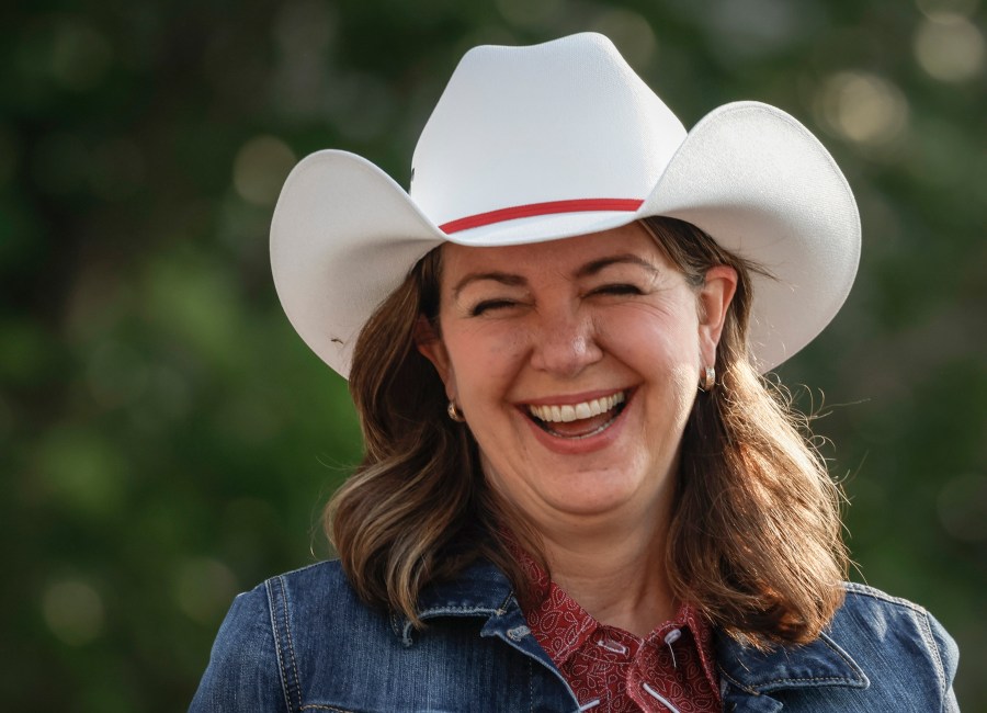 File - Alberta Premier Danielle Smith wears a cowboy hat during the Calgary Stampede parade in Calgary, Friday, July 7, 2023. (Jeff McIntosh /The Canadian Press via AP, File)