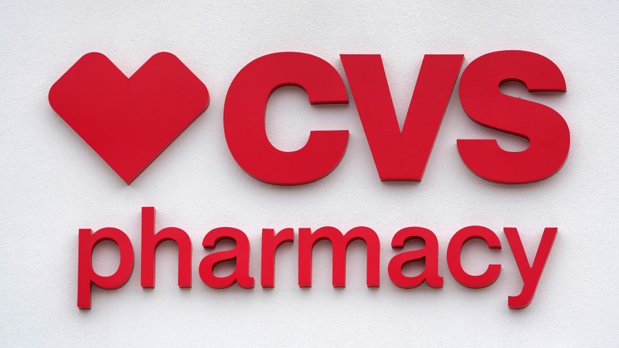 FILE - The CVS Pharmacy logo is displayed on a store on Aug. 3, 2021, in Woburn, Mass. (AP Photo/Charles Krupa, File)