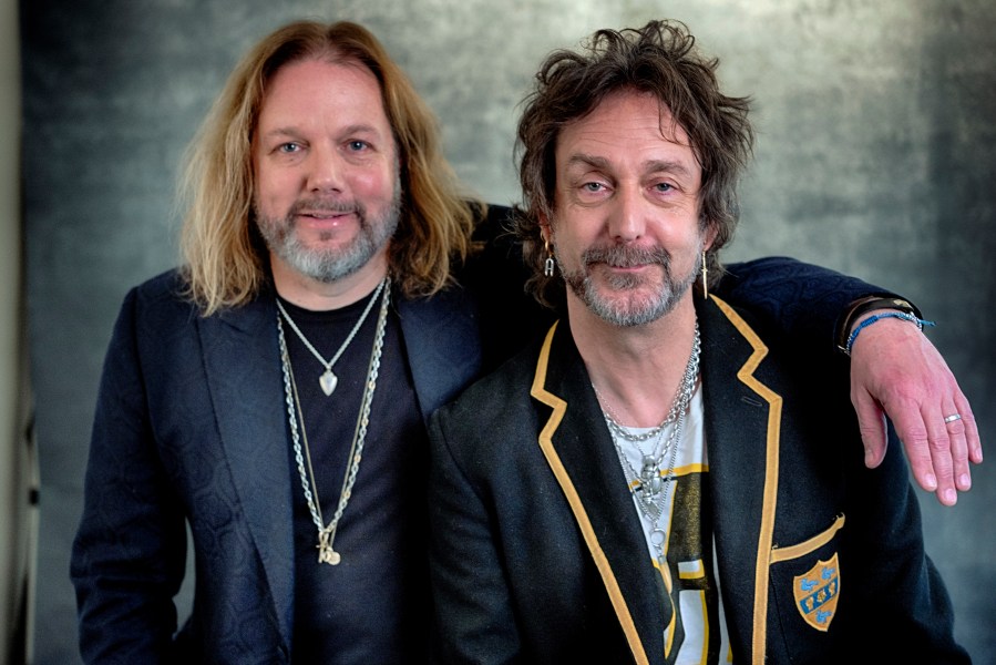 Rich Robinson, left, and his brother Chris Robinson of The Black Crowes pose for a portrait in Los Angeles on Monday, Dec. 9, 2024. (AP Photo/Richard Vogel)