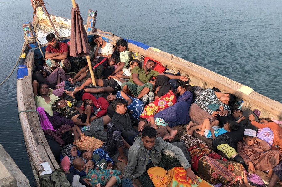 A group of people believed to be Rohingya refugees, rest in a boat at a port in Trincomalee, Sri Lanka, Friday, Dec. 20, 2024. (AP Photo/Mangalanath Liyanaarahhi)