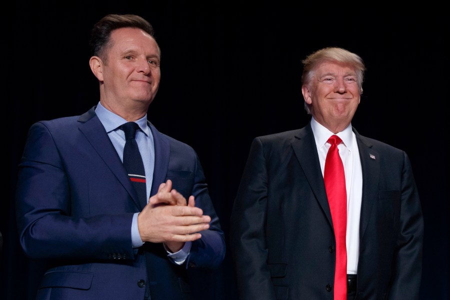 FILE - Television producer Mark Burnett, left, looks on as President Donald Trump arrives for the National Prayer Breakfast, Feb. 2, 2017, in Washington. (AP Photo/Evan Vucci, File)