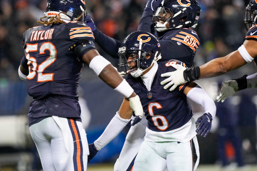 Chicago Bears cornerback Kyler Gordon (6) celebrates his fumble recovery with teammates during the second half of an NFL football game against the Seattle Seahawks, Thursday, Dec. 26, 2024, in Chicago. (AP Photo/Nam Y. Huh)