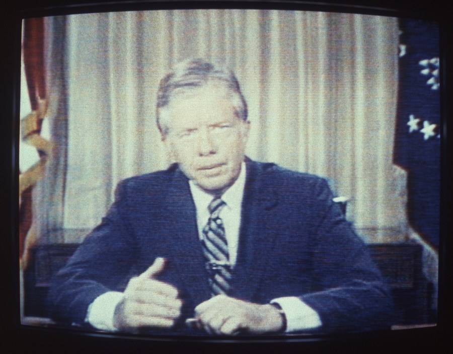 FILE - In an image from a television screen, President Jimmy Carter delivers his energy speech in which he spoke of a "crisis of confidence," July 15, 1979, from the Oval Office at the White House in Washington. Some referred to the speech as his "malaise speech," although he never used that word during it. (AP Photo/Dale G. Young, File)